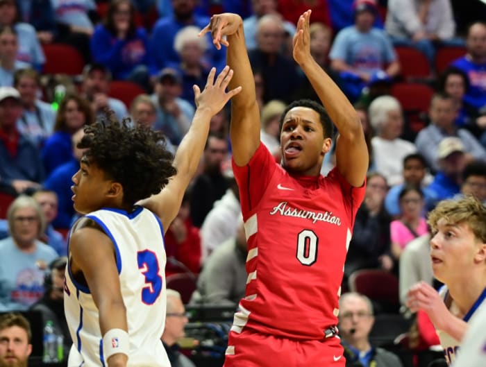 Davenport Assumption's Damyen Jackson takes a shot against Decorah's Trey McCain during a Class 3A state tournament semifinal game at Wells Fargo Arena in Des Moines on Thursday. (Photo by Ryan Timmerman)